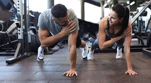 Toning Bingo Wings: Your Ultimate Guide to Sculpting Sleek Arms at the Gym 3 Fitness trainer demonstrating arm toning exercises East Sussex