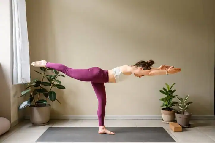 Woman doing Yoga exercise  East Sussex to help with toning the body. 