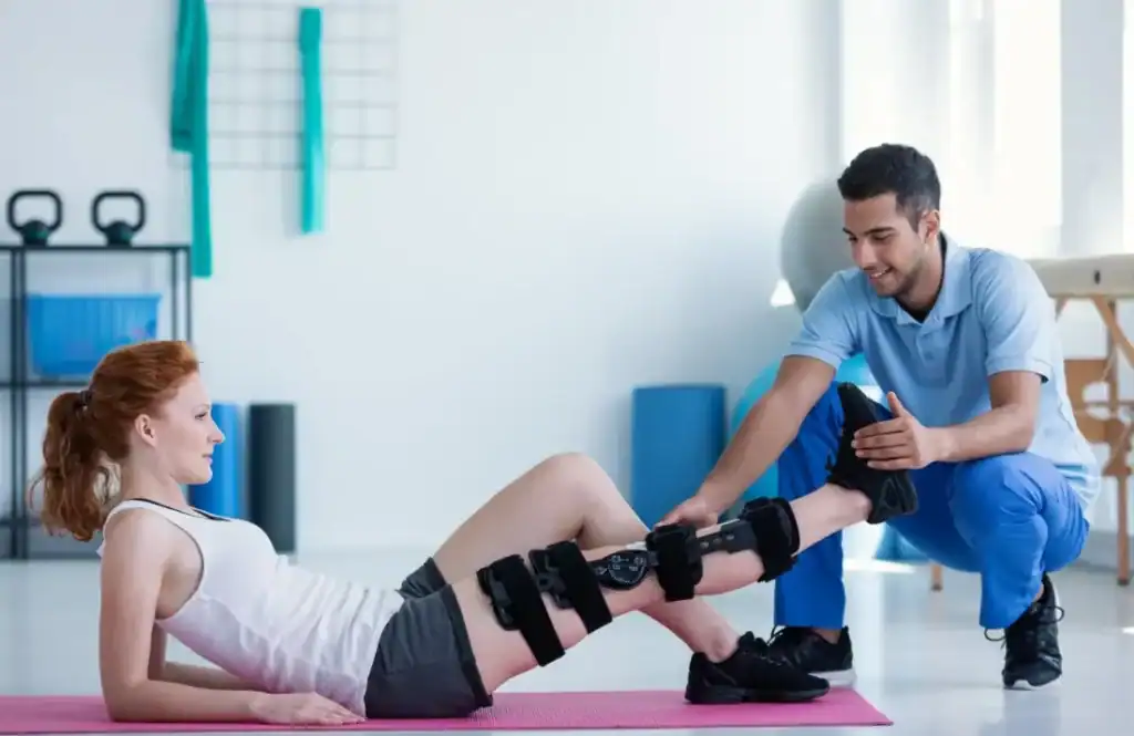 Woman having treatment to help muscle recovery  East Sussex after an injury